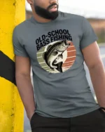 Retro Style Old School Bass Fishing Distressed Sunset Tshirt - model wearing grey tee, leaning on column