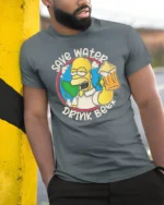 Save Water Drink Beer Character Earth Graphic Tshirt - model wearing grey tee, leaning on column