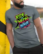 Ride The Neon Wave Skateboard Streetwear Graphic Tee - model wearing grey tee, leaning on column