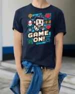 Vibrant Pixel Art Game On Retro Controller Graphic Tshirt - model wearing navy tee with hands in pockets