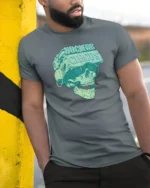 Cybernetic VR Skull Nuclear Circus Virtual Reality Tshirt - model wearing grey tee, leaning on column