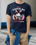 Wicked Easter Witch Bunny Chainsaw Horror Graphic Tshirt - model wearing navy tee with hands in pockets