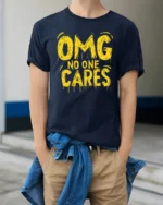 Sarcastic OMG No One Cares Dripping Text Graphic Tshirt - model wearing navy tee with hands in pockets