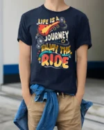 Colorful Bicycle Quote Enjoy The Ride Adventure Graphic Tee - model wearing navy tee with hands in pockets