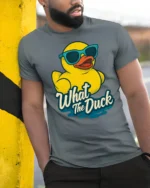 Cool Rubber Duck Wearing Sunglasses What The Duck Tshirt - model wearing grey tee, leaning on column