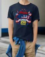 Festive Patriotic 4th Of July Est 1776 250 Years Graphic Tee - model wearing navy tee with hands in pockets
