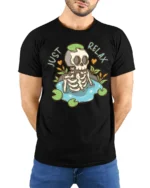 Sarcastic Just Relax Skeleton Pond Lily Pad Graphic Tshirt - model wearing black tee with hands behind back