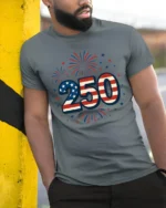 Patriotic Fireworks American Flag 250 Years Graphic Tee - model wearing grey tee, leaning on column