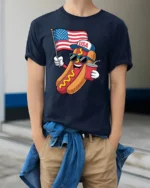 Festive USA Hot Dog American Flag Patriotic Graphic Tee - model wearing navy tee with hands in pockets