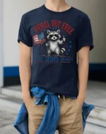 Feral But Free Raccoon American Flag Patriotic Tshirt - model wearing navy tee with hands in pockets