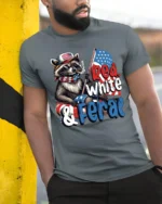 Sarcastic Red White And Feral Raccoon Patriotic Graphic Tee - model wearing grey tee, leaning on column