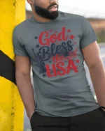 Patriotic God Bless The USA Lady Liberty Graphic Tshirt - model wearing grey tee, leaning on column