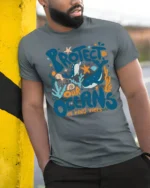 Colorful Marine Life Protect Our Oceans Be Kind Vibes Tshirt - model wearing grey tee, leaning on column