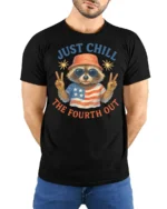 Funny Raccoon Just Chill The Fourth Out Independence Day Tee - model wearing black tee with hands behind back