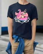 Funny Flamingo Pool Party Graphic Tee Summer Drink Cartoon Tshirt - model wearing navy tee with hands in pockets