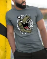 Cool Dinosaur T Rex Roar Comic Style Graphic Tee Fun Tshirt - model wearing grey tee, leaning on column