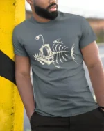 Deep Sea Angler Skeleton Fish Vintage Ocean Graphic Tee Tshirt - model wearing grey tee, leaning on column