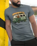 Nature Is Our Home Camper Van Adventure Graphic Tee Tshirt - model wearing grey tee, leaning on column