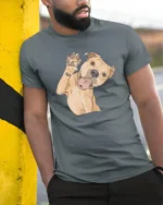 Cute Happy Dog Waving Paw Cartoon Graphic Tee Tshirt - model wearing grey tee, leaning on column