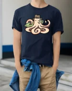 Cool Octopus Surfer with Hat and Pipe Funny Graphic Tee - model wearing navy tee with hands in pockets