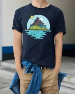 Scenic Mountain Island and Deep Sea Life Graphic Soft Tee - model wearing navy tee with hands in pockets