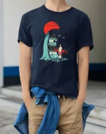 Surreal Surfer Sunset Giant Wave Graphic Soft Tshirt - model wearing navy tee with hands in pockets