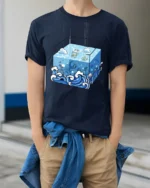 Surreal Ocean Cube Wave Cartoon Deep Sea Artistic T Shirt - model wearing navy tee with hands in pockets