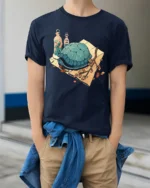 Whimsical Garden Turtle and Botanical Glass Vials Tshirt - model wearing navy tee with hands in pockets