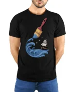 Creative Ocean Paint Brush Wave Ship Artistic Graphic T Shirt - model wearing black tee with hands behind back