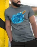 Deep Blue Whale Ocean Rowing Boat Adventure Graphic Tshirt - model wearing grey tee, leaning on column