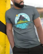 Scenic Mountain Island and Deep Sea Life Graphic Soft Tee - model wearing grey tee, leaning on column