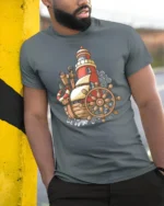 Vintage Nautical Ship Lighthouse Adventure Graphic Tshirt - model wearing grey tee, leaning on column