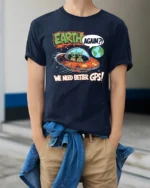 Funny Alien Earth Again We Need Better GPS Graphic Soft Tshirt - model wearing navy tee with hands in pockets