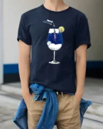 Creative Dreamy Starry Night Midnight Wine Glass Graphic Tshirt - model wearing navy tee with hands in pockets
