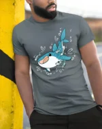 Adorable Whale Shark Ocean Friends Cartoon Graphic Tshirt - model wearing grey tee, leaning on column