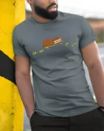 Funny Flying Money Wallet Financial Humor Graphic Tee - model wearing grey tee, leaning on column