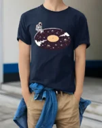 Surreal Astronaut Vinyl Record Space Galaxy Graphic Tshirt - model wearing navy tee with hands in pockets
