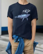 Whimsical Whale Save The Ocean Marine Pollution Graphic Tshirt - model wearing navy tee with hands in pockets