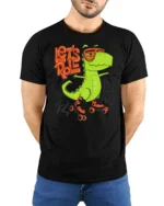 Funny Lets Roll Dinosaur Roller Skating Graphic Tshirt - model wearing black tee with hands behind back