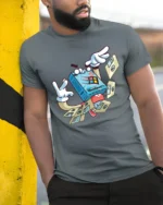 Retro Floppy Disk Windows 98 Cartoon Character Graphic Tee - model wearing grey tee, leaning on column