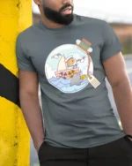 Whimsical Guinea Pig Sailor Narwhal Message Bottle Tshirt - model wearing grey tee, leaning on column