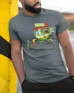 Futuristic Fast Food Mecha Mobile Diner Graphic Tshirt - model wearing grey tee, leaning on column