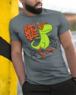 Funny Lets Roll Dinosaur Roller Skating Graphic Tshirt - model wearing grey tee, leaning on column