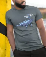 Whimsical Whale Save The Ocean Marine Pollution Graphic Tshirt - model wearing grey tee, leaning on column