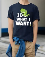 Sassy Baby T Rex I Do What I Want Diaper Graphic Tshirt - model wearing navy tee with hands in pockets