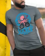 Funny Octopus Cyclist Certified Sucker Speed Graphic Tshirt - model wearing grey tee, leaning on column