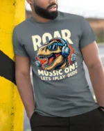 Roaring Music T Rex Dinosaur Retro Headphones Graphic Tshirt - model wearing grey tee, leaning on column