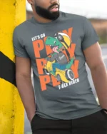 Dynamic Scooter T Rex Riding Helmet Biker Graphic Tshirt - model wearing grey tee, leaning on column