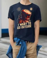 Intriguing I Want To Go Outside Astronaut Graphic Tee - model wearing navy tee with hands in pockets