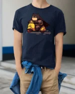 Chibi Hero Yellow Scooter Ride Graphic Tee - model wearing navy tee with hands in pockets